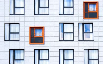 Photo of different windows with two standing out in color.
