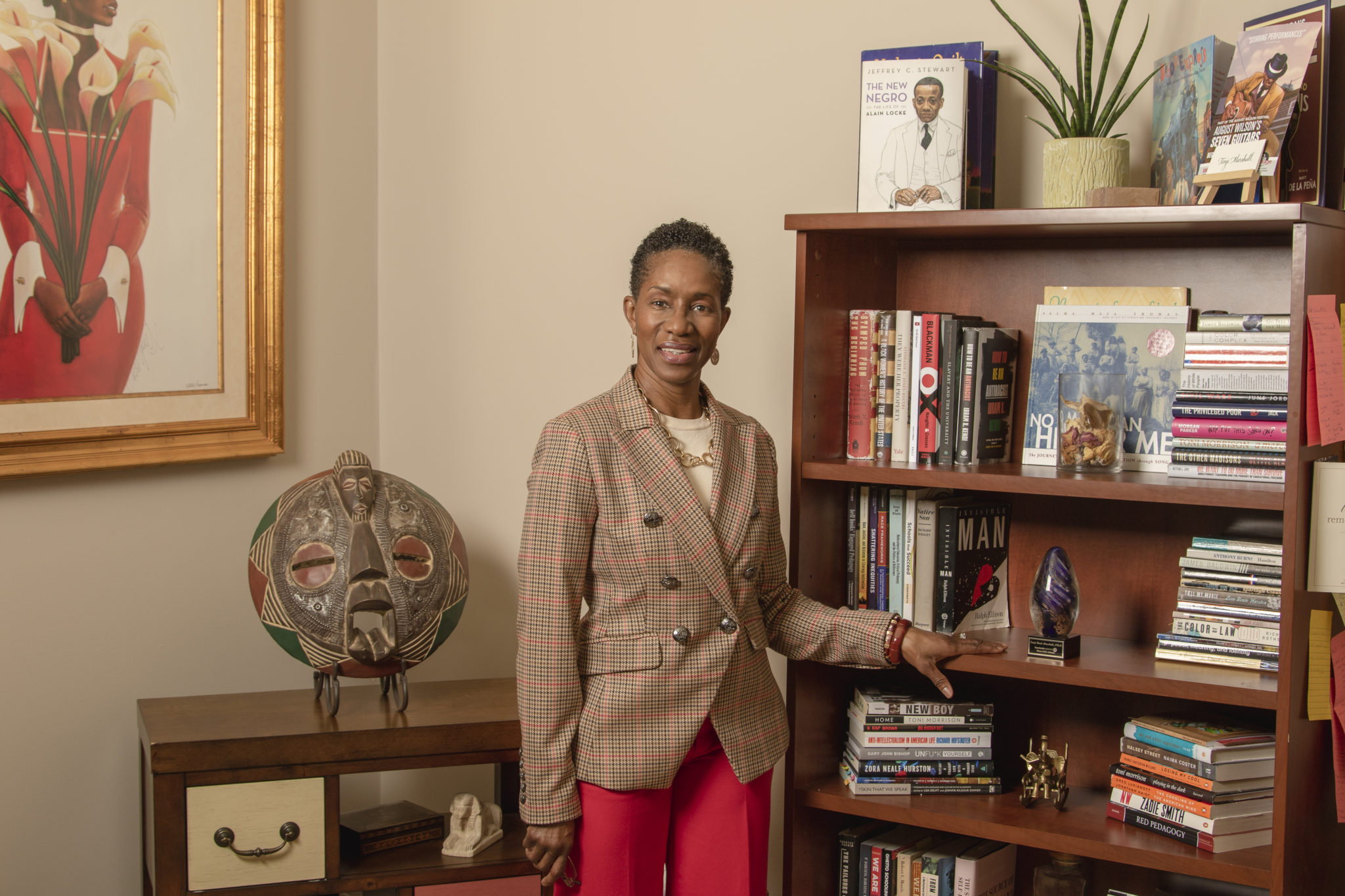 Branding Client standing in her library.