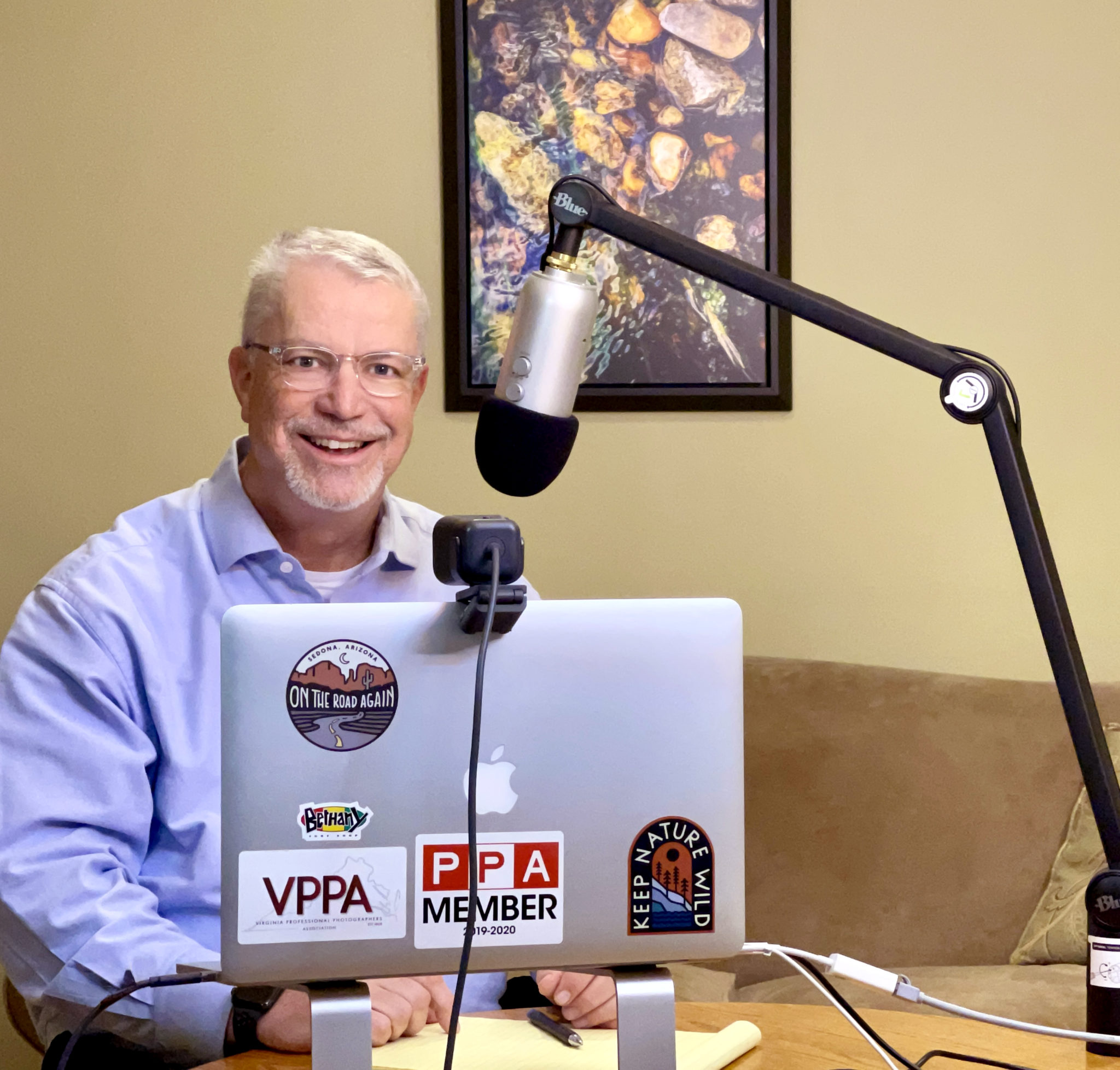 Business Coach, Doug Mattice sitting at his podcast table.